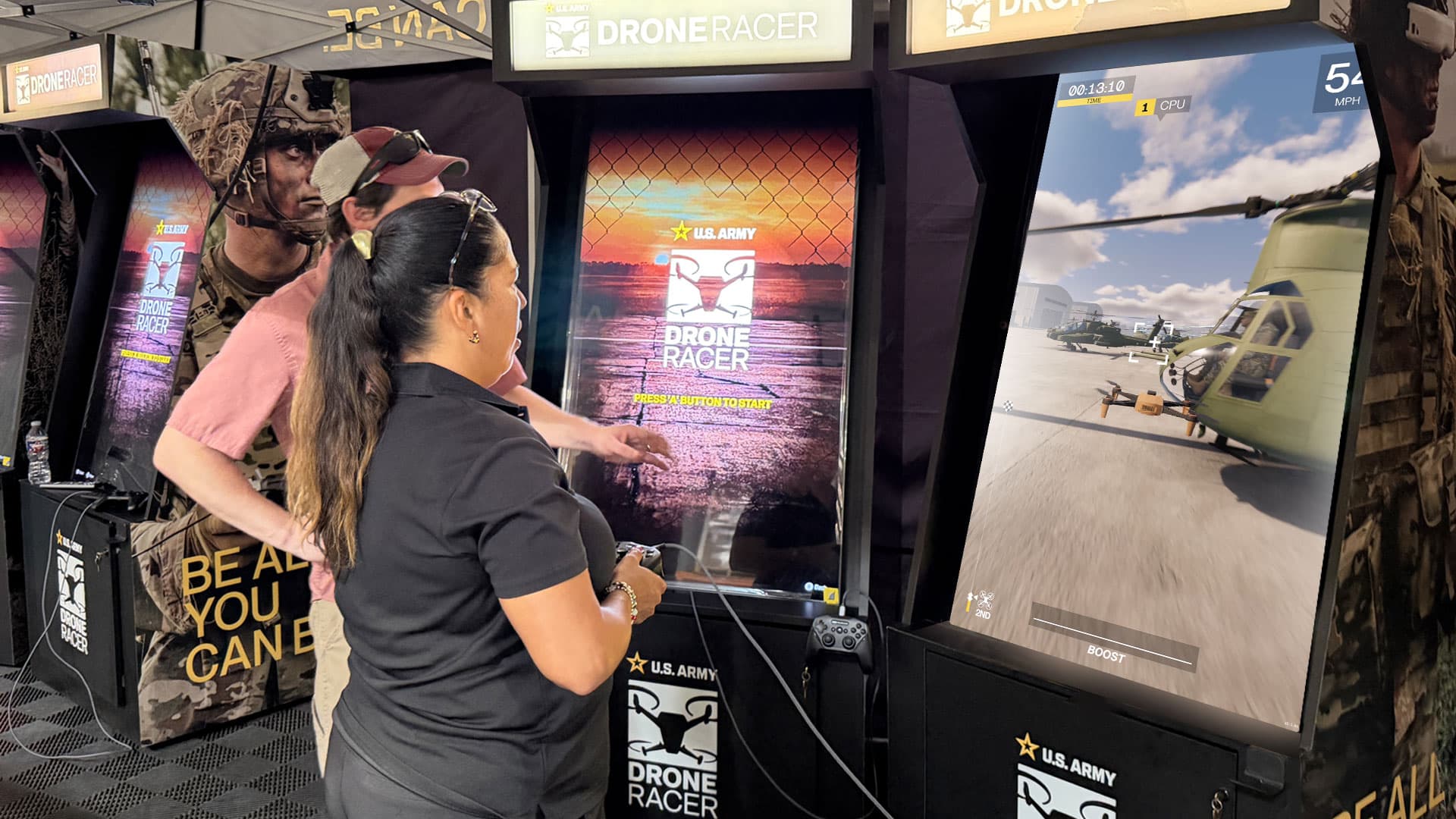 Guests using controllers at Army Drone Racer arcade cabinets