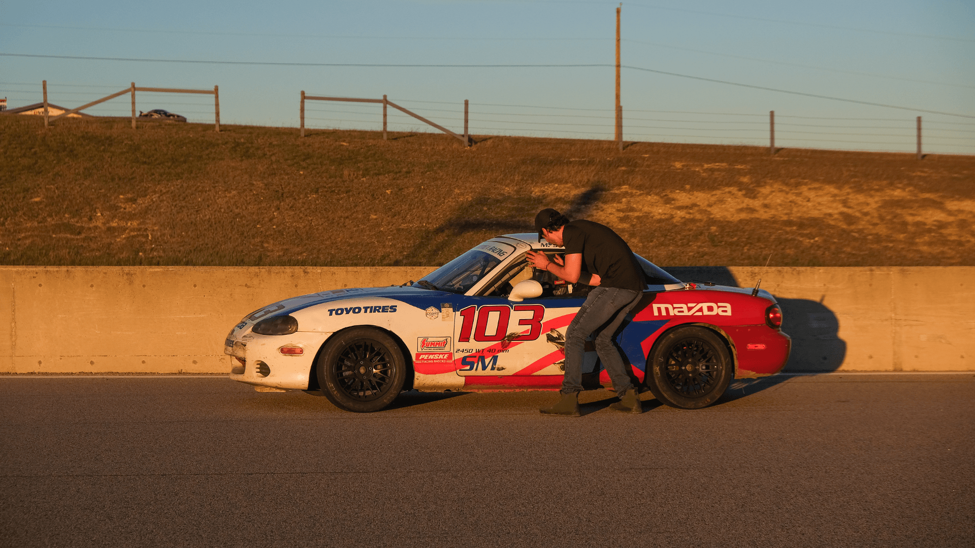 Karim Youssef directing production with Max's race car